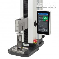 Zkušební rám F305-EM zobrazený v konfiguraci pro zkoušku stlačení pružiny